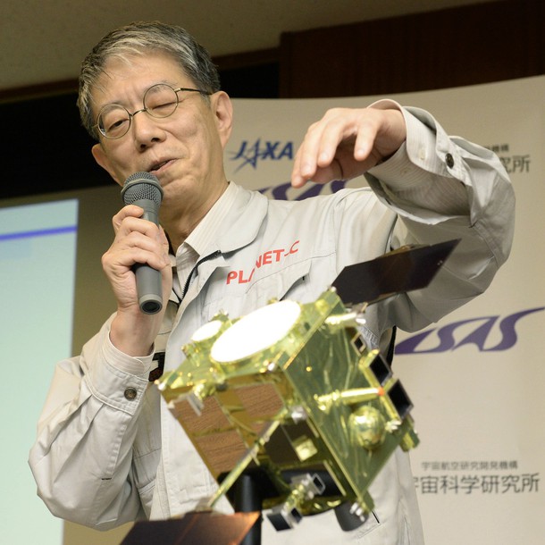 Masato Nakamura, professor at the Japan Aerospace Exploration Agency, meets with reporters in front of a model of its probe Akatsuki.