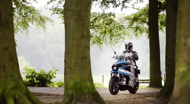 Around the world in 80 days with an electric motorcycle